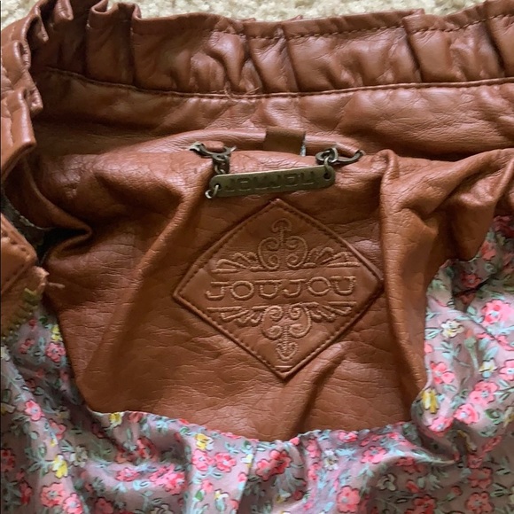 a brown leather jacket - Picture 2 of 2